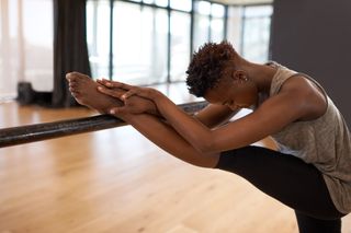 Barre benefits: a woman stretching
