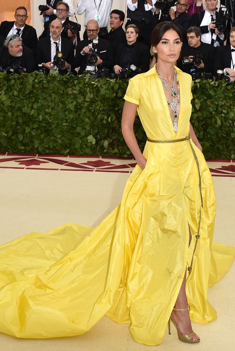 Red carpet, Yellow, Fashion, Dress, Clothing, Carpet, Gown, Haute couture, Fashion model, Flooring,