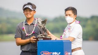 Ratchanon Chantananuwat with the Trust Golf Asian Mixed Cup trophy