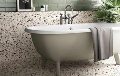 Bathroom backsplash ideas with terrazzo tiles and a freestanding tub