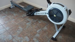 Image shows a side view of the Concept2 RowErg in a room.