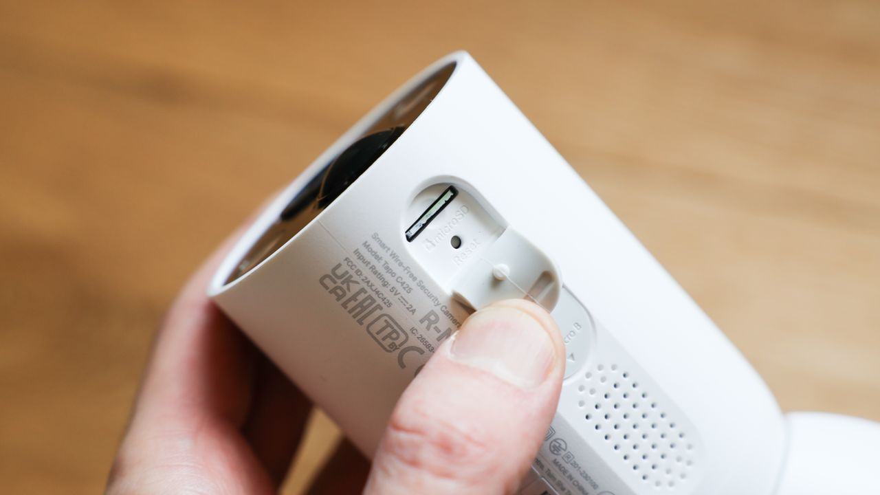 TP-Link Tapo C425 security camera held in a hand
