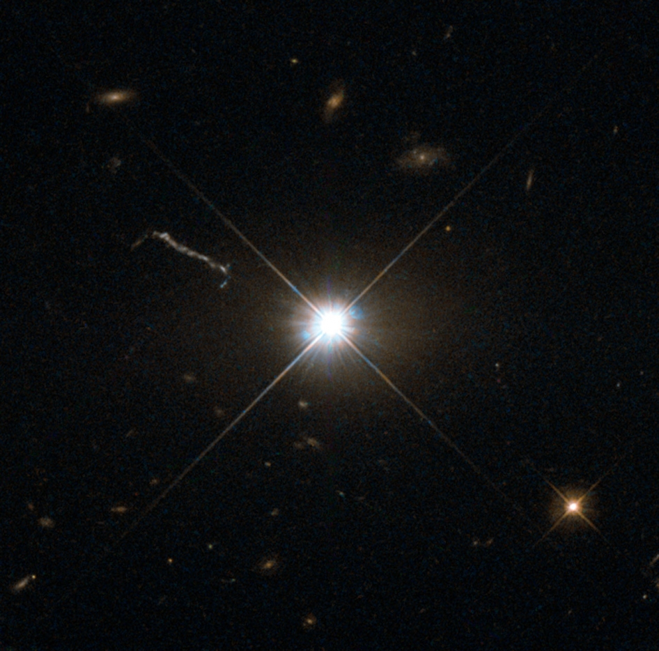 The Hubble Space Telescope captured this image of ancient and brilliant quasar 3C 273, which resides in a giant elliptical galaxy in the constellation of Virgo. Its light has taken some 2.5 billion years to reach us. Despite this great distance, it is still one of the closest quasars to our home. It was the first quasar ever to be identified, and was discovered in the early 1960s by astronomer Allan Sandage.