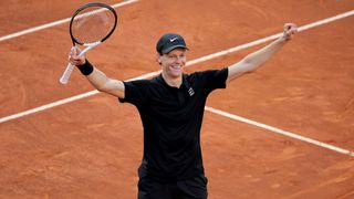 Jannik Sinner celebrates winning a clay court tournament in 2026
