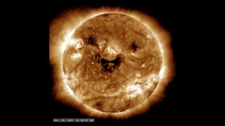 Several solar coronal holes are visible in an entertaining configuration in this SDO imagery taken from the AIA camera with the 193 Angstrom filter.