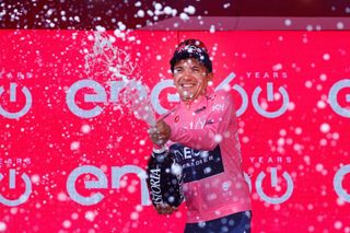 Overall leader Team Ineos Ecuadorian rider Richard Carapaz celebrates on the podium after the 19th stage of the Giro dItalia 2022 cycling race 178 kilometers from Marano Lagunare to Santuario di Castelmonte northeastern Italy on May 27 2022 Photo by Luca Bettini AFP Photo by LUCA BETTINIAFP via Getty Images