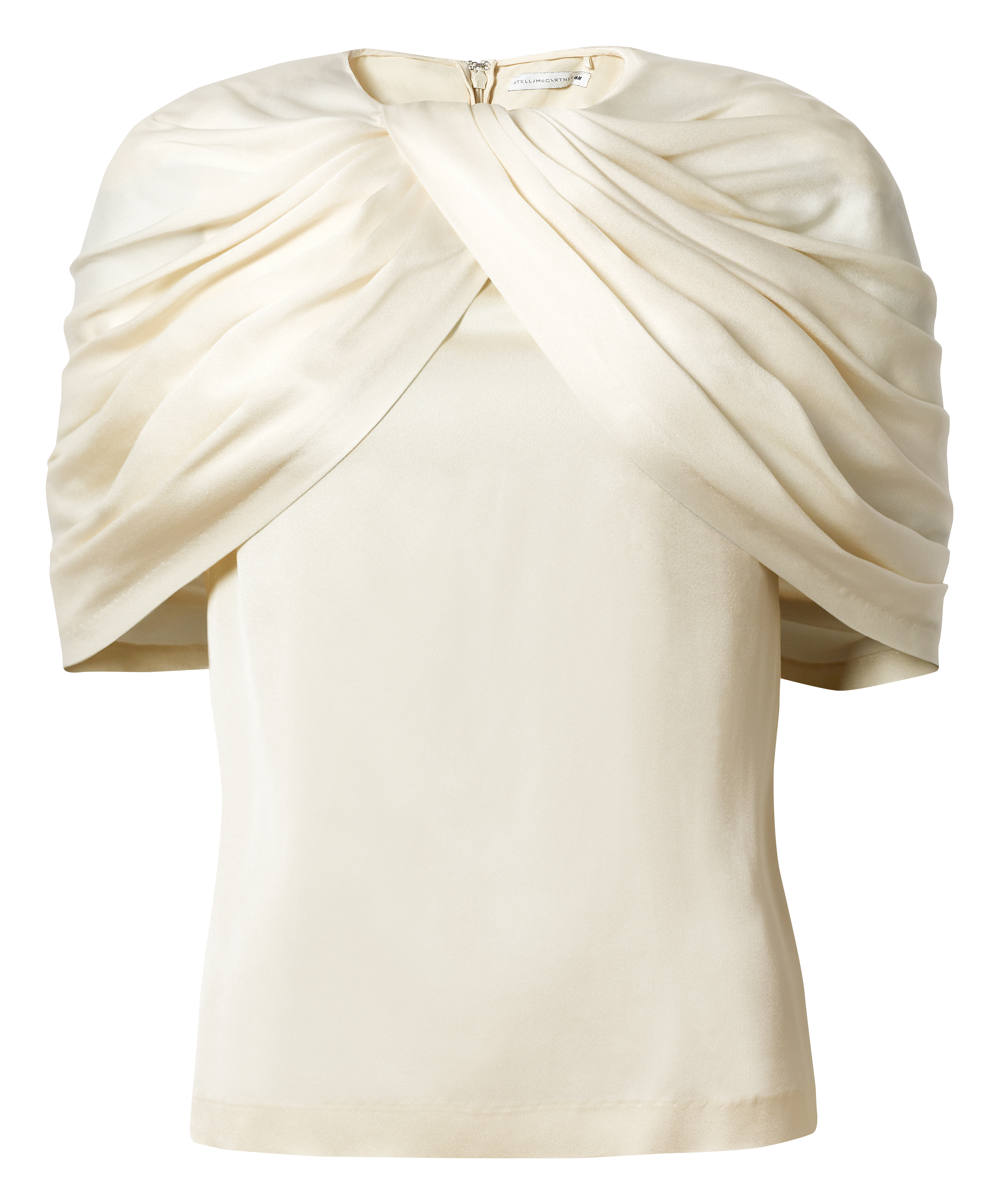 clothes from the H&M x Stella McCartney collaboration on a plain backdrop