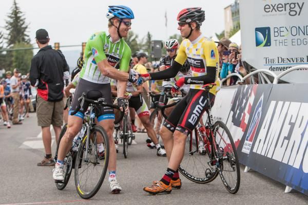 Sprint leader Tyler Farrar (Garmin-Sharp) greets race leader Tejay van Garderen (BMC) on the start line.