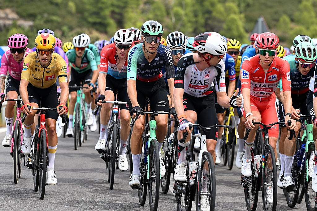 ARAMON VALDELINARES, SPAIN - AUGUST 29: (L-R) Tobias Halland Johannessen of Norway and Team Uno-X Mobility, Oscar Chamberlain of Australia and Team Decathlon CMA CGM and Tadej Pogacar of Slovenia and UAE Team Emirates XRG - Red Leader Jersey compete during the La Vuelta - 81st Tour of Spain 2026, Stage 7 a 149.48m stage from Vall d&amp;amp;apos;Alba to Aramon Valdelinares 1965m / #UCIWT / on August 29, 2026 in Aramon Valdelinares, Spain. (Photo by Tim de Waele/Getty Images)