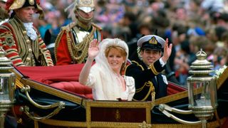 The Duke and Duchess of York waving to the crowds who have gathered to see them on the day of their wedding