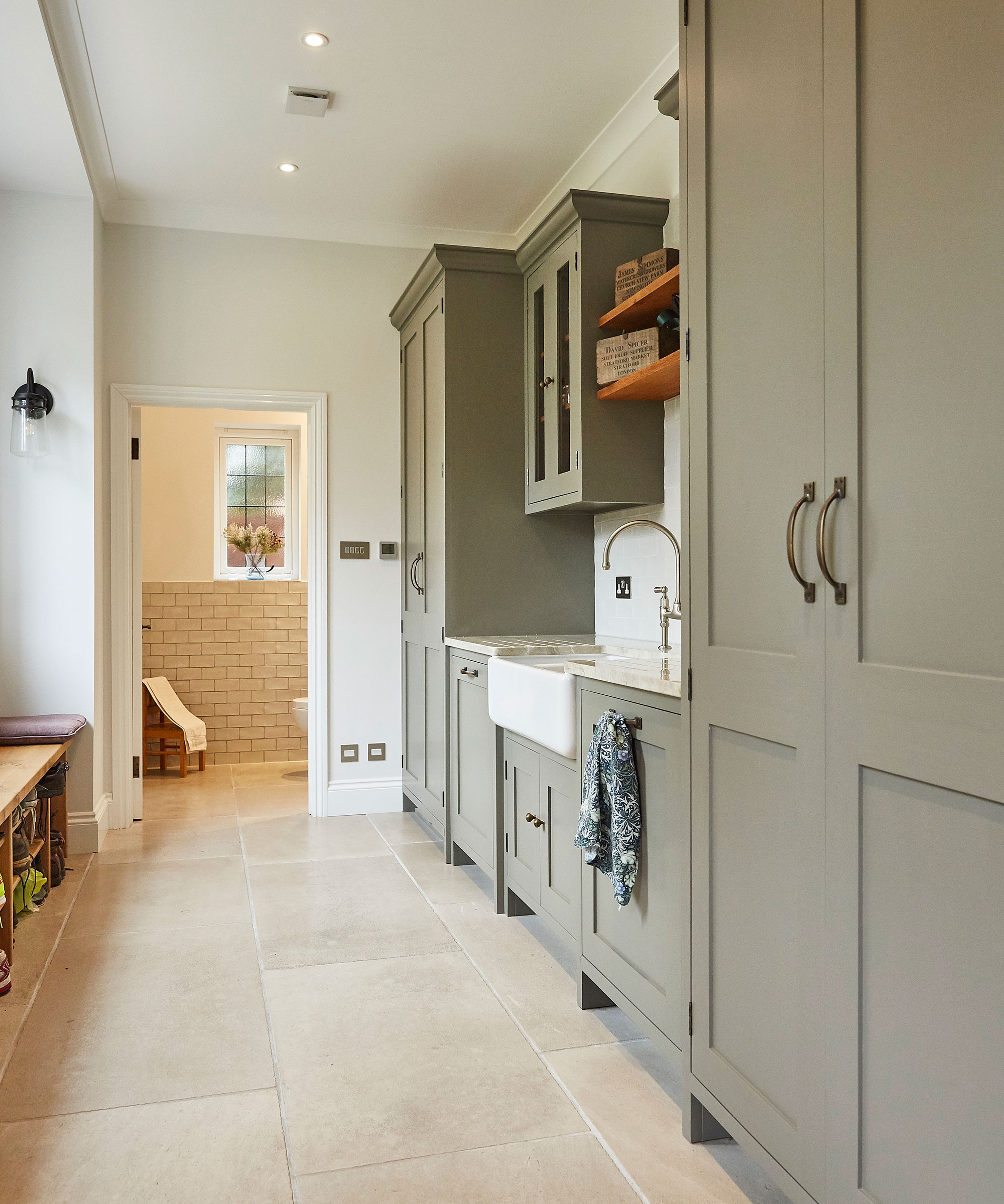 stone grey fitted boot room with sink