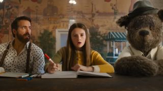 From left to right Ryan Reynolds as Cal, Cailey Fleming as Bea holding a marker looking shocked and Louis the bear in IF.