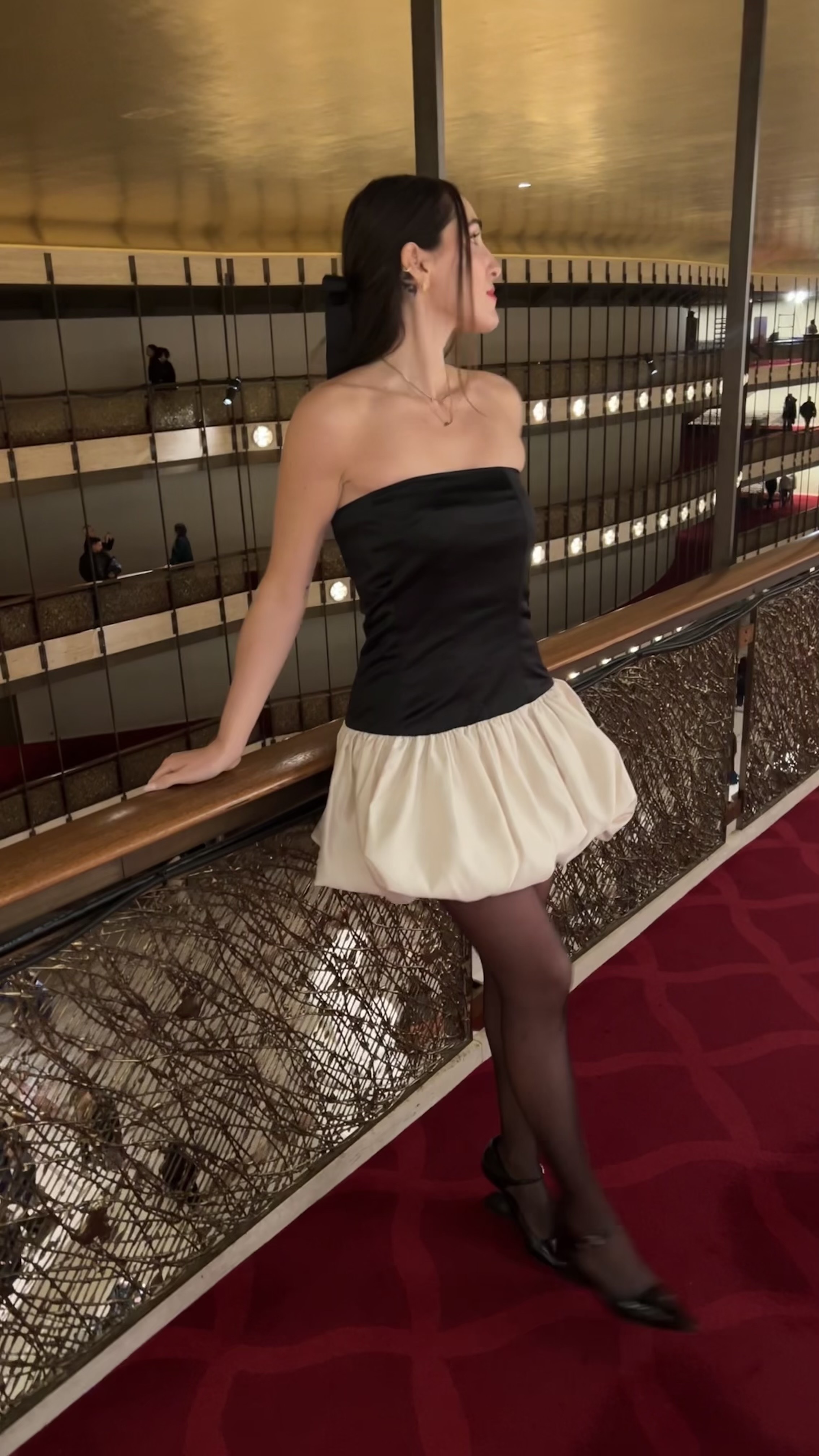 Anna LaPlaca at the Nutcracker ballet at Lincoln Center wearing a satin bubble-hem Marlies Grace dress