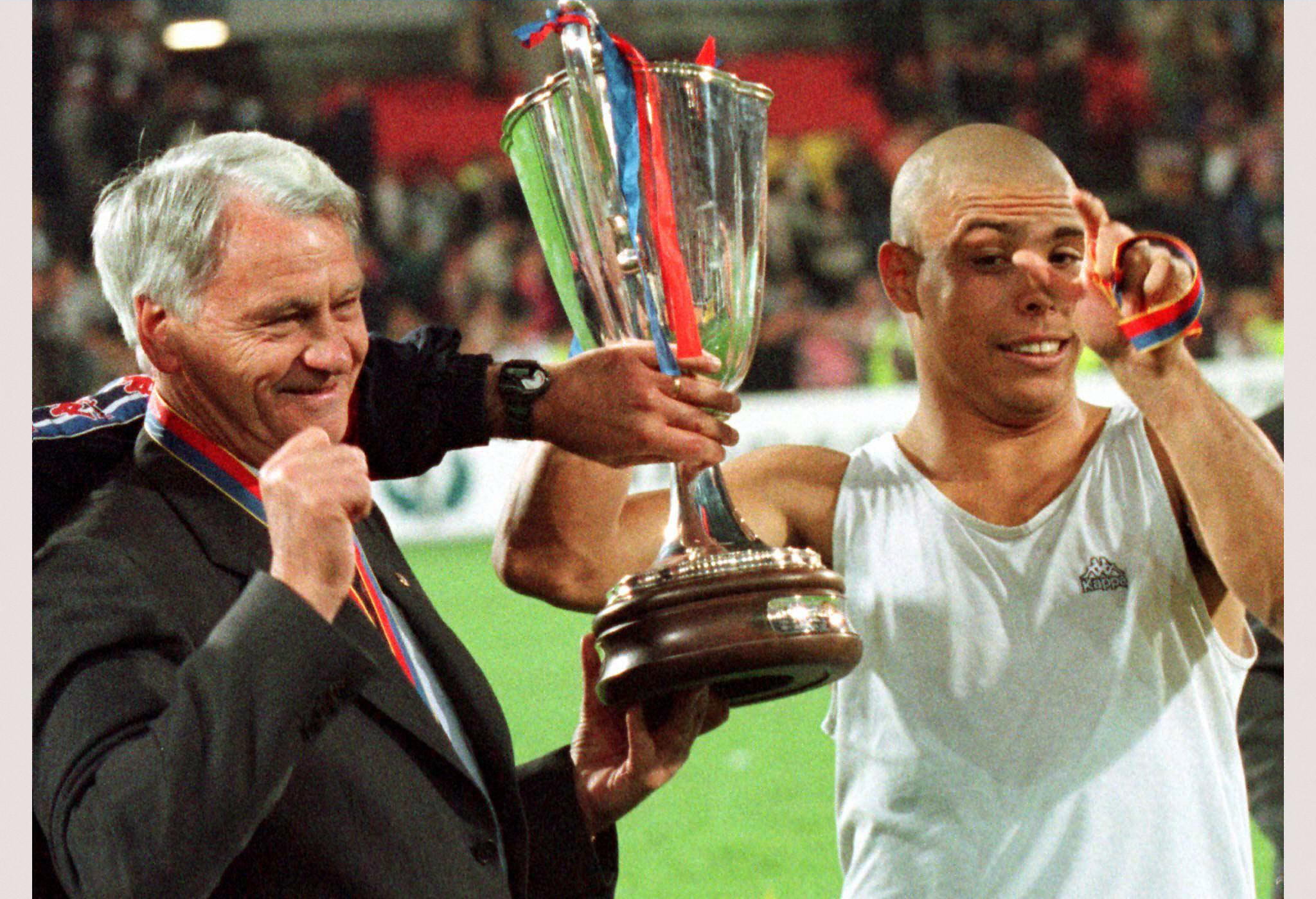 Bobby Robson and Ronaldo hold the UEFA Cup Winners' Cup after Barcelona's win over Paris Saint-Germain in the final in 1997.