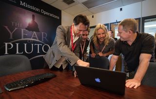 Styx and Stern: Styx band members are intrigued by the latest images of Pluto and Charon from New Horizons. Left to right: Lawrence Gowan, Todd Sucherman, Tommy Shaw, New Horizons principal investigator Alan Stern.