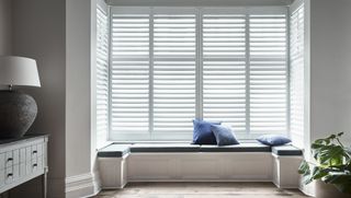 a bay window idea for built in seating and shutters