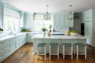 A kitchen with blue painted cabinets