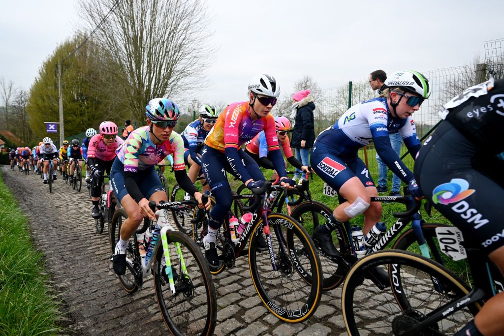 OUDENAARDE BELGIUM APRIL 02 LR Katarzyna Niewiadoma of Poland and Team CanyonSRAM Racing Lotte Kopecky of Belgium and Team SD Worx and Maud Rijnbeek of The Netherlands and AG InsuranceSoudal QuickStep Team compete passing through a cobblestones sector during the 20th Ronde van Vlaanderen Tour des Flandres 2023 Womens Elite a 1566km one day race from Oudenaarde to Oudenaarde UCIWWT on April 02 2023 in Oudenaarde Belgium Photo by Luc ClaessenGetty Images