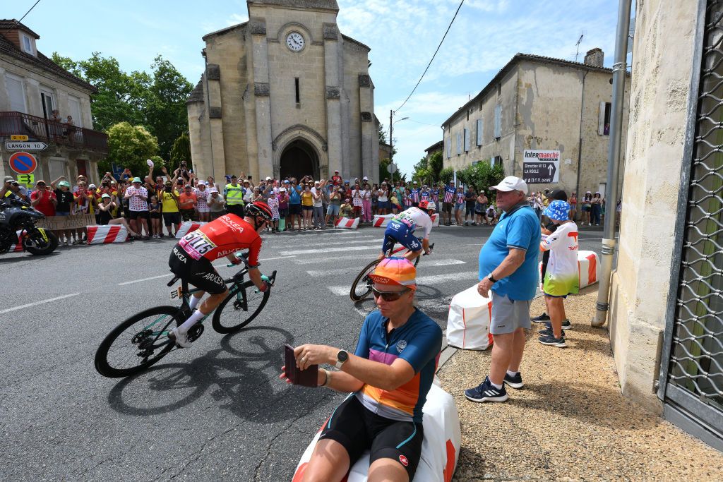 BORDEAUX FRANCE JULY 07 A general view of Simon Guglielmi of France and Team ArkaSamsic and Pierre Latour of France and Team TotalEnergies compete in the breakaway through a village during the stage seven of the 110th Tour de France 2023 a 1699km stage from Mont de Marsan to Bordeaux UCIWT on July 07 2023 in Bordeaux France Photo by David RamosGetty Images