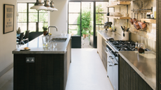 small kitchen extension with glass roof and black cabinets