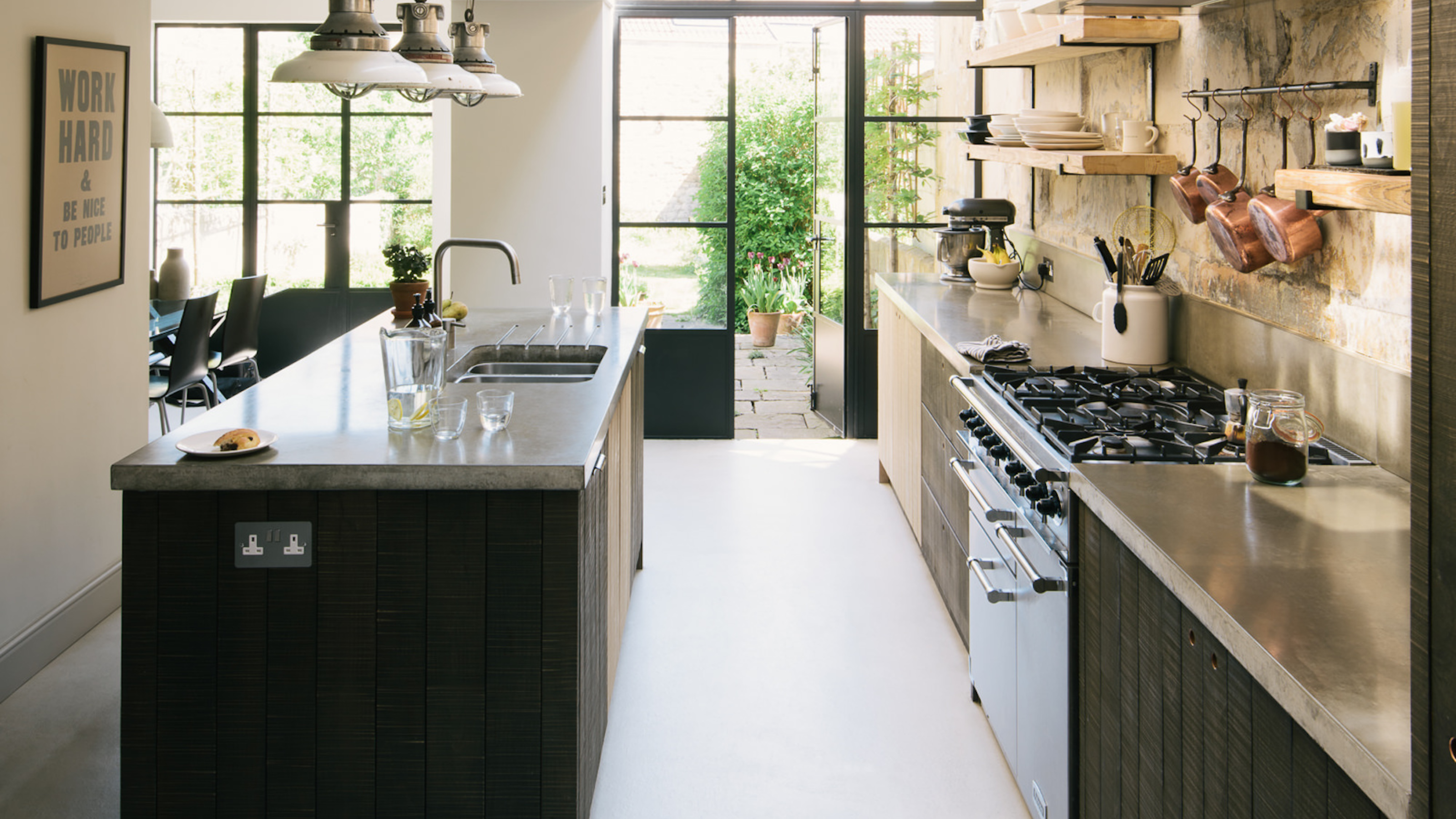 small kitchen extension with glass roof and black cabinets