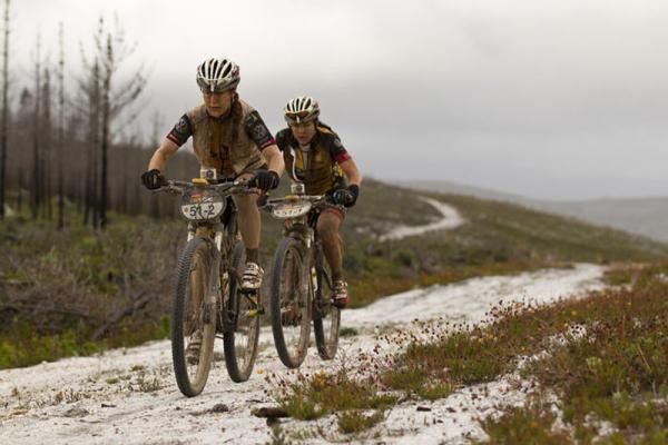 Jane Nuessli and Karien van Jaarsveld of MTN Quebeka during stage 5 of the 2012 Absa Cape Epic Mountain Bike stage race from the Overberg Primary &amp; High School in Caledon to Oak Valley Wine Estate in the Elgin Valley, South Africa on the 30 March 2012
