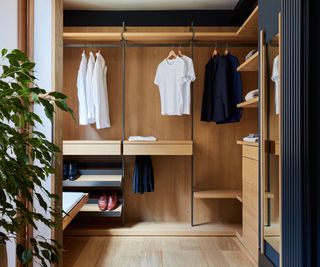 solid timber walk-in closet with wooden flooring