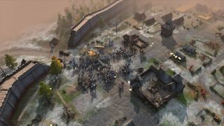 Age of Empires IV army seiges an enemy town