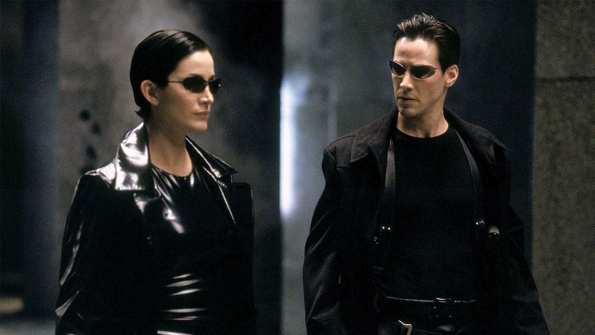 Carrie-Anne Moss as Trinity and Keanu Reeves as Neo in The Matrix