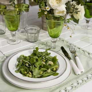 Keep things simple on the table, making it feel special with silver-edged china. You can’t go wrong with a crisp white set. Team with pretty place mats in a soft shade to add subtle colour to the table and introduce coloured glassware - green is the perfect choice for a garden setting. Similar china John Lewis Similar glassware Grand Illusions Similar place mats Zara Home
