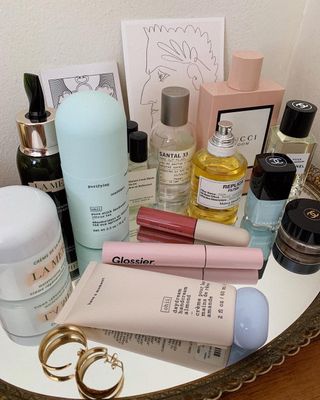 Skincare products on a mirrored tray