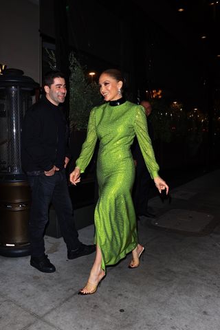 Singer and songwriter Jennifer Lopez turned heads in a gorgeous green dress as she stepped out to celebrate her manager Benny’s birthday at Novikov in Beverly Hills. The superstar lit up the evening with her stylish appearance.