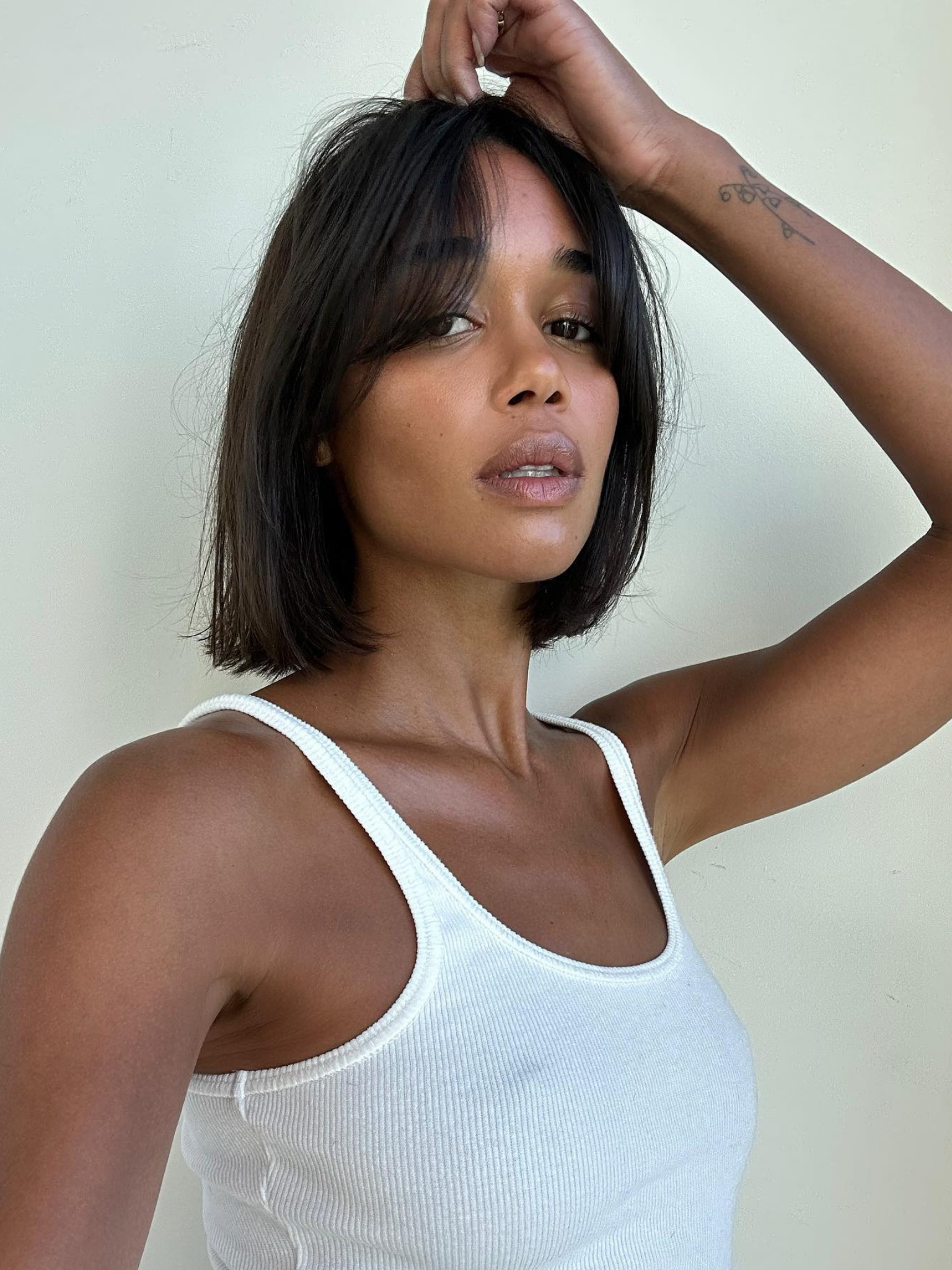 Laura Harrier with curtain bangs