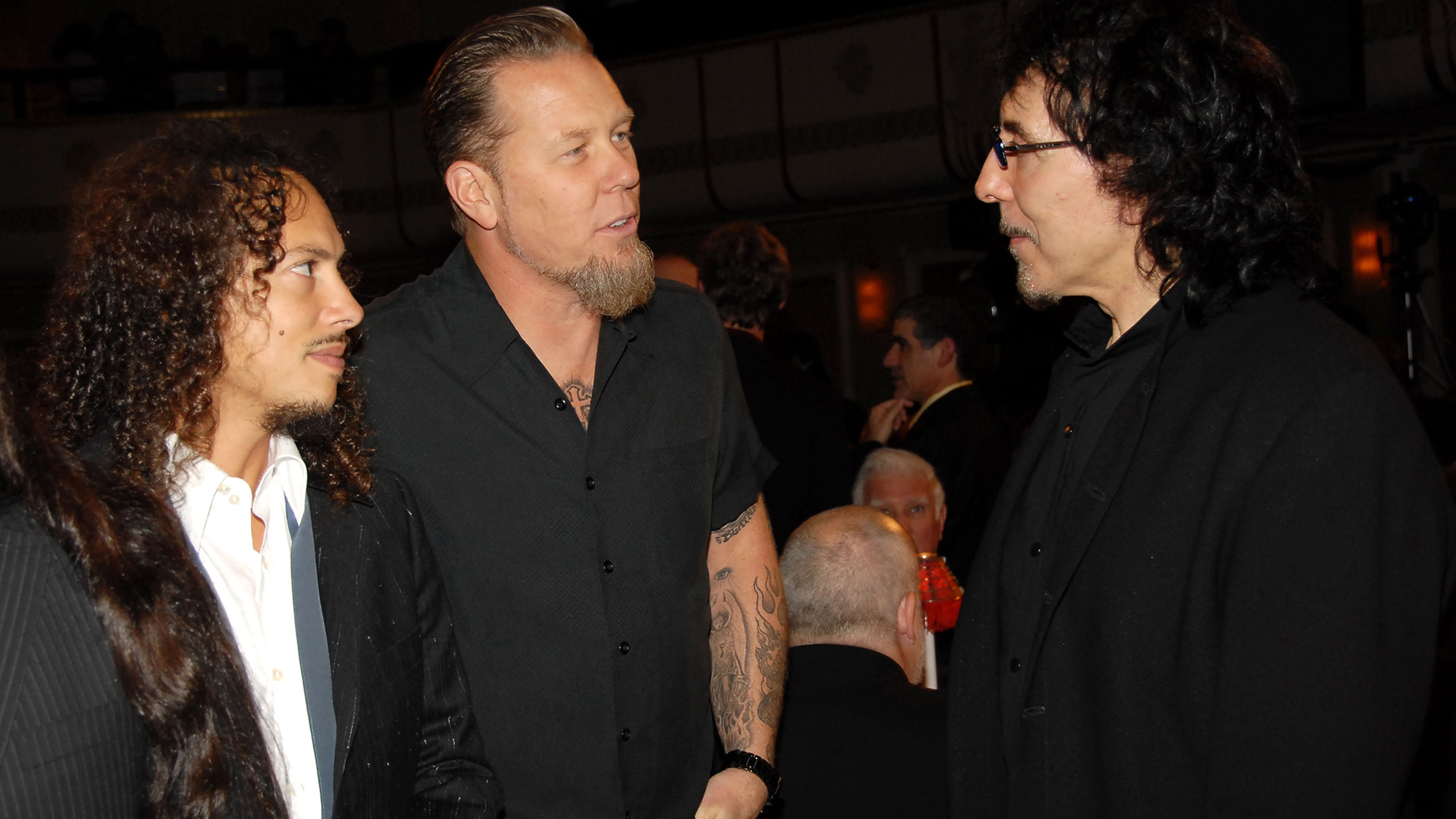 Kirk Hammett and James Hetfield of Metallica with Tony Iommi of Black Sabbath, inductee, 13 March, 2006
