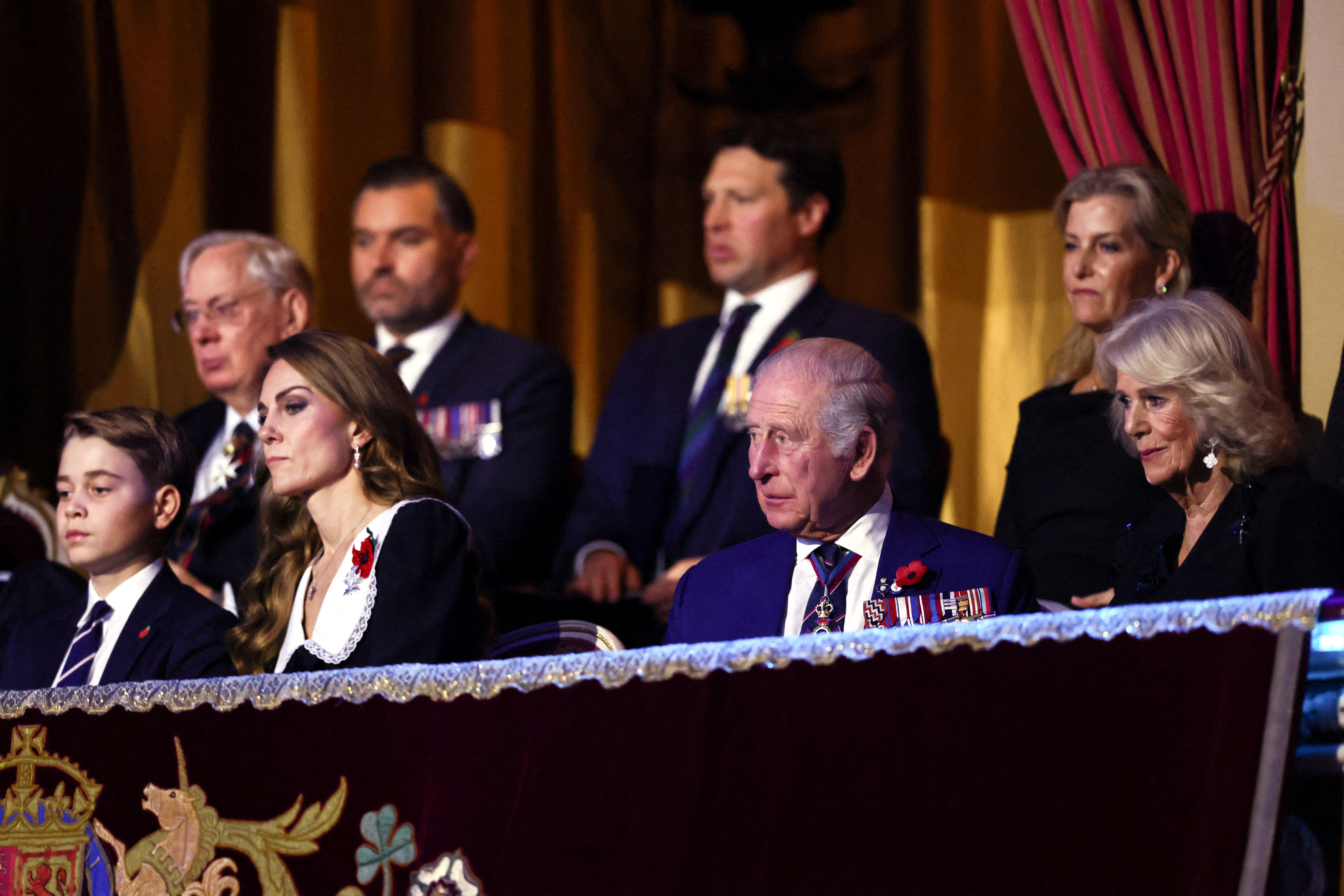 Prince George sits with Princess Kate, King Charles and Queen Camilla at the Festival of Remembrance