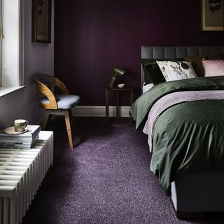 bedroom with wooden chair teacup and purple carpet