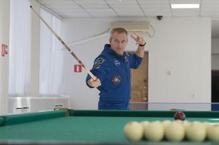 Canadian Space Agency David Saint-Jacques played pool with his crewmembers before launching to the International Space Station on Dec. 3, 2018, from Baikonur Cosmodrome in Kazakhstan.