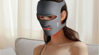 A woman wearing the Flikeze LED face mask