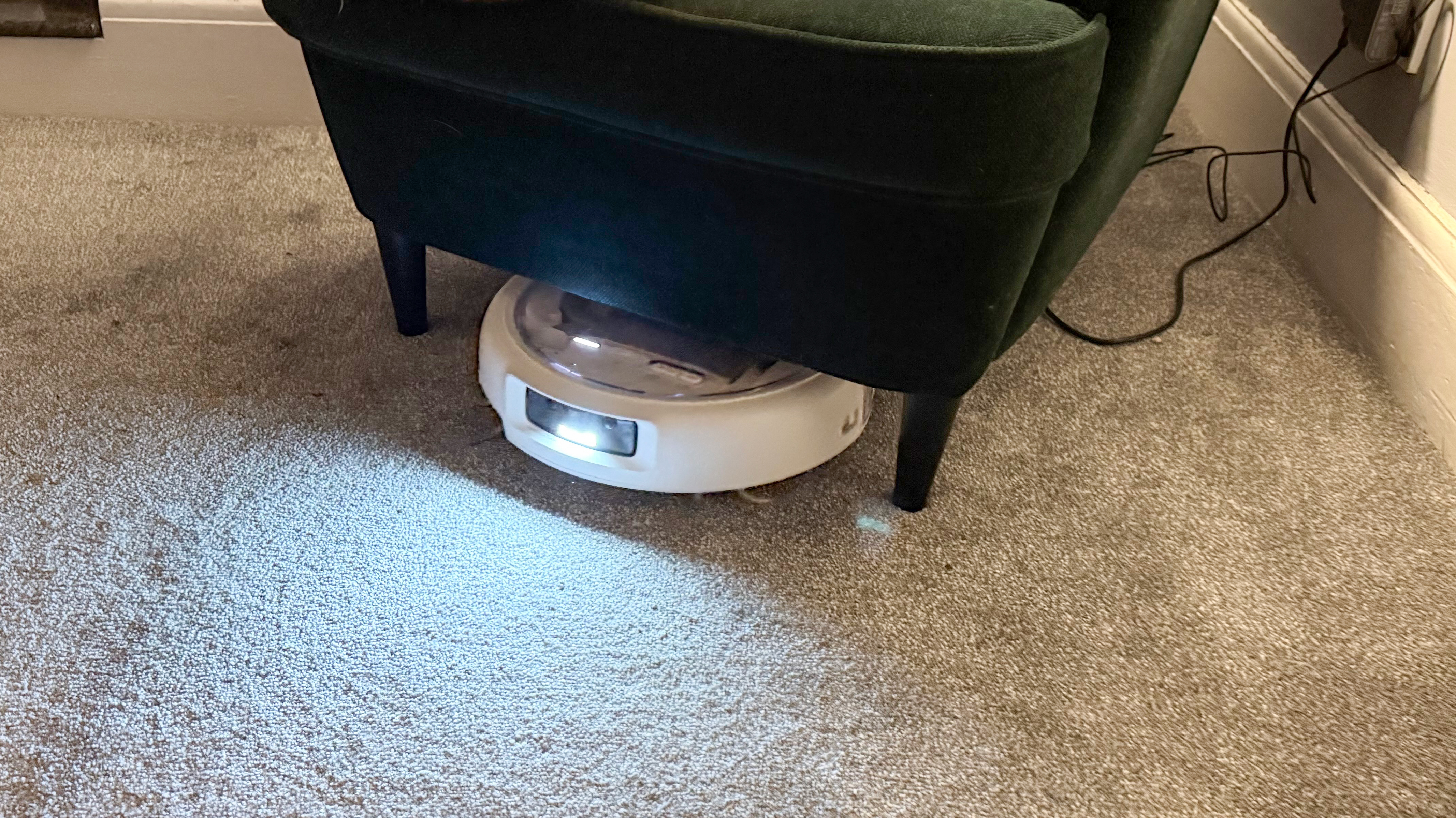 The DJI Romo P under a chair