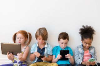 Kids using devices-cell phone, tablet computer, laptop computer
