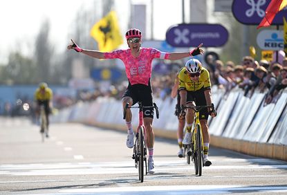 Neilson Powless crosses finish line with arms outsretched