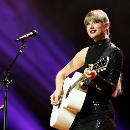 Taylor Swift performs onstage at the NSAI 2022 Nashville Songwriter Awards in 2022