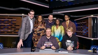 Alison, Rob and Josh with some of the famous guests posing on the Smart TV set