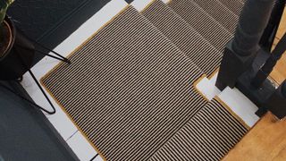striped carpet on stair winder