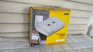 Zanussi Double Electric Blanket in its box on a bed