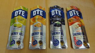 OTE energy gels for cycling on a wooden table