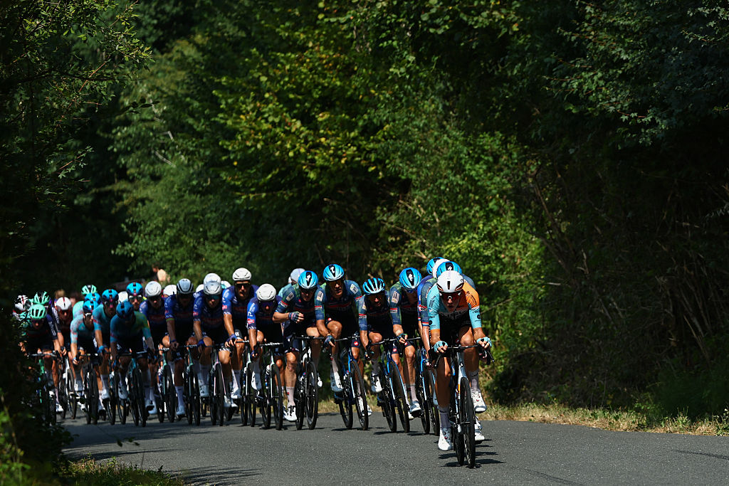 The pack of riders (peloton) cycles during the 7th stage of the 113th edition of the Tour de France cycling race, 175,1 km between Hagetmau and Bordeaux in southwestern France, on July 10, 2026. (Photo by Anne-Christine POUJOULAT / AFP)