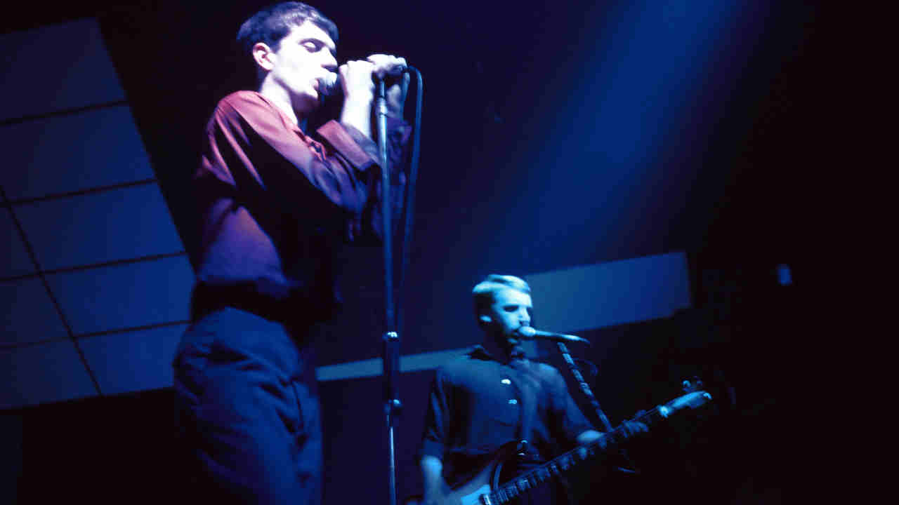 Joy DIvision performing onstage in 1980