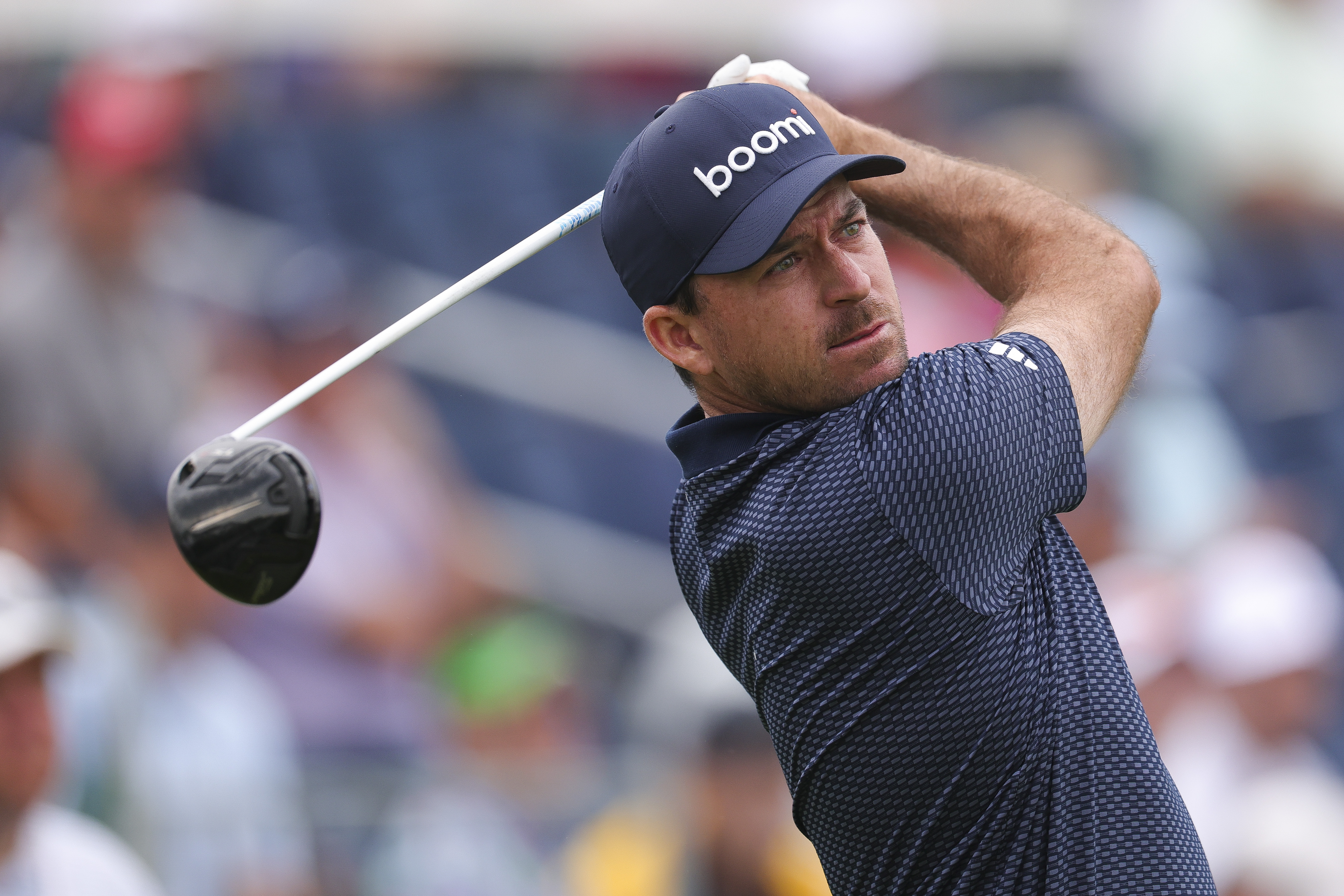Nick Taylor hits a shot with a driver