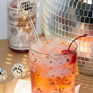 Christmas cocktail with disco ball stirrer